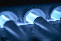 Burner flame inside a gas furnace during heating services in Houston