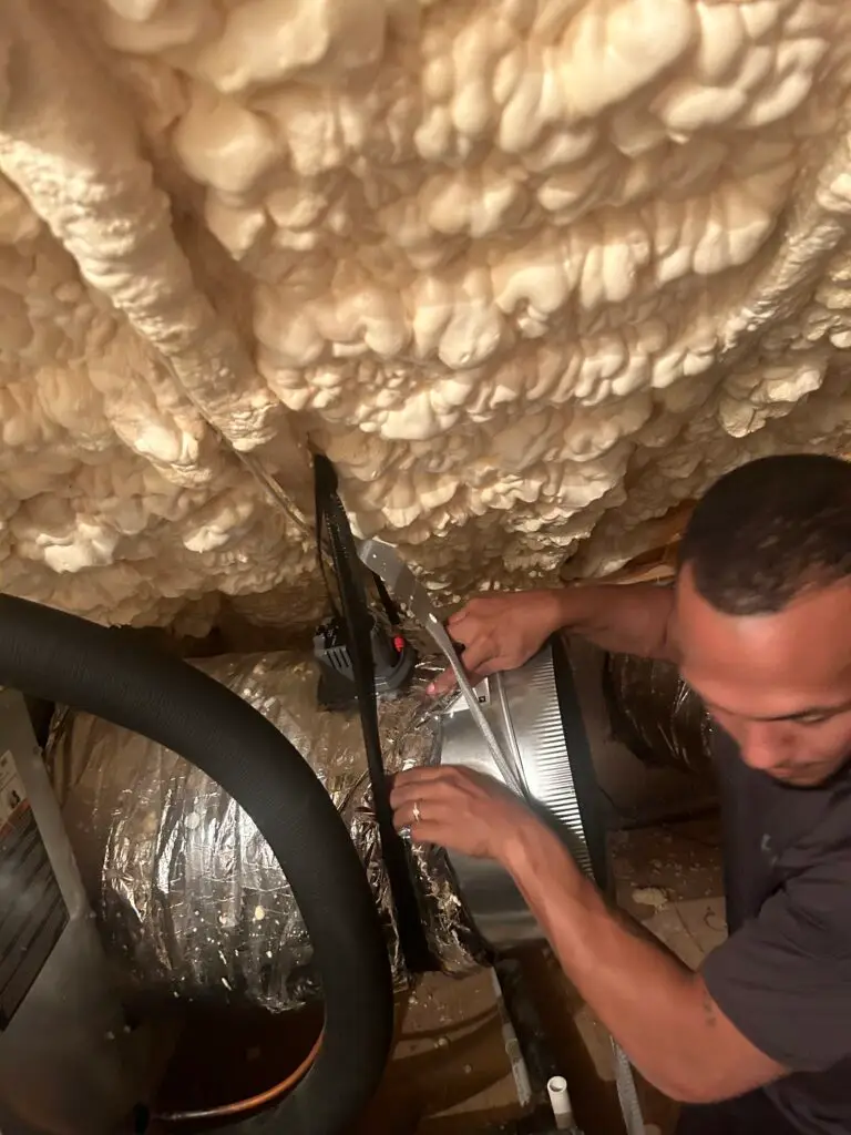 Technician Installing Residential Ductwork